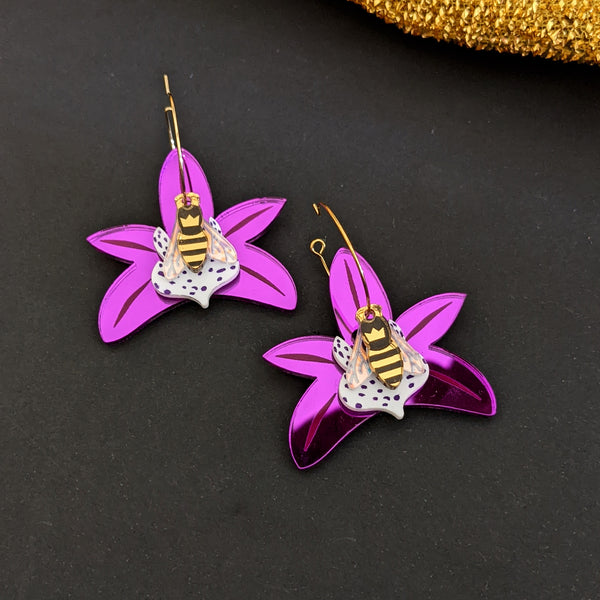 Honeybee resting on flower hoop earrings