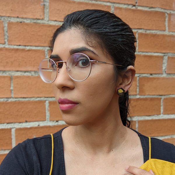 elegant woman wearing stud hexagon jewelry
