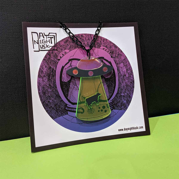 Gorgeos out of this world alien space craft pendant on cow artword