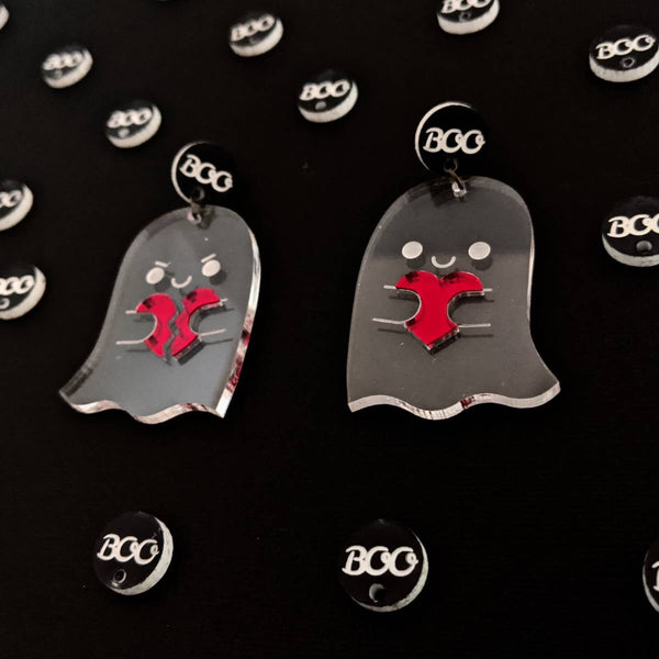 Halloween earrings featuring clear spooky ghosts with mirror red hearts