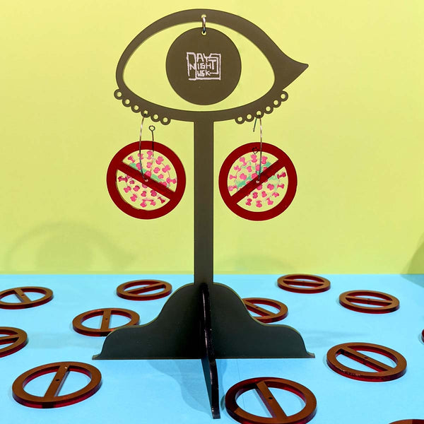 Pandemic earrings on stand dangling