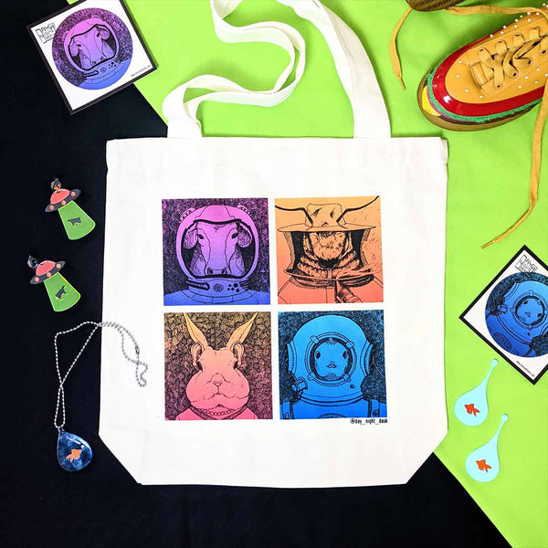Eco friendly animal tote bag featuring bees, fish, rabbits and cows. Bright, graphic square colours on a fun, eco-friendly Handbag