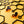 Load image into Gallery viewer, Orange and black honeycomb studs dripping with honey
