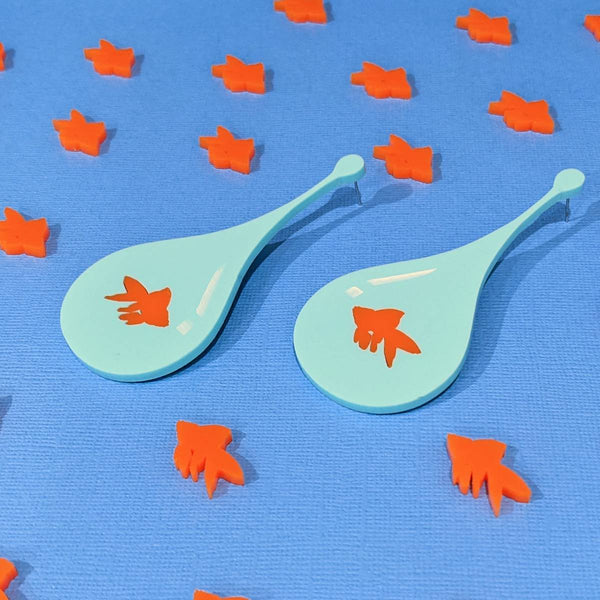 Stylish teardrop earrings made from teal acrylic featuring orange goldfish