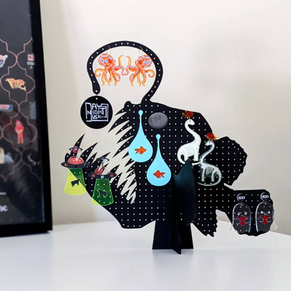 Black anglerfish earring stand and as a cool room accessory				