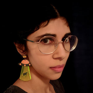 Unique UFO earrings with black spaceship abducting cow in a fluro beam