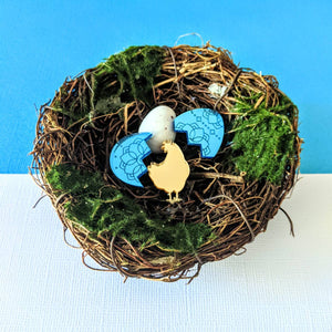 Blue Easter egg stud earrings with a surprise golden hen pin