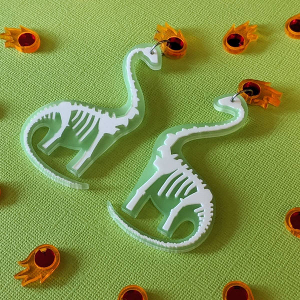 Fun earrrings, frosty green dinosaur skeleton earrings featuring mirror asteroids handmade in Australia