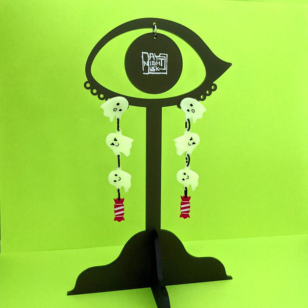 glow in the dark costume ghost jewelry on a stand
