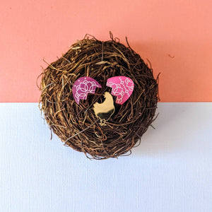 Pink Easter egg stud earrings with a surprise golden hen pin